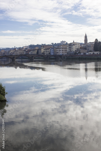 Beautiful reflection in water of the sky, on Florence Arno river