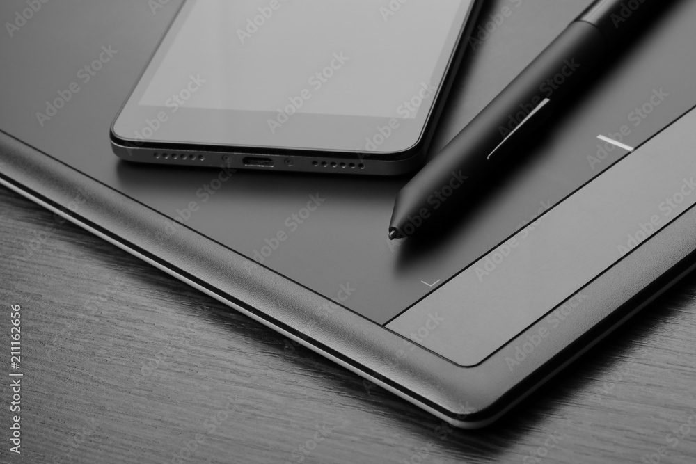 Smartphone and graphic tablet (also known as a digitizer or digital art board) with a special pen-like stylus Smartphone and graphic tablet (also known as a digitizer or digital art board) with a special pen-like stylus