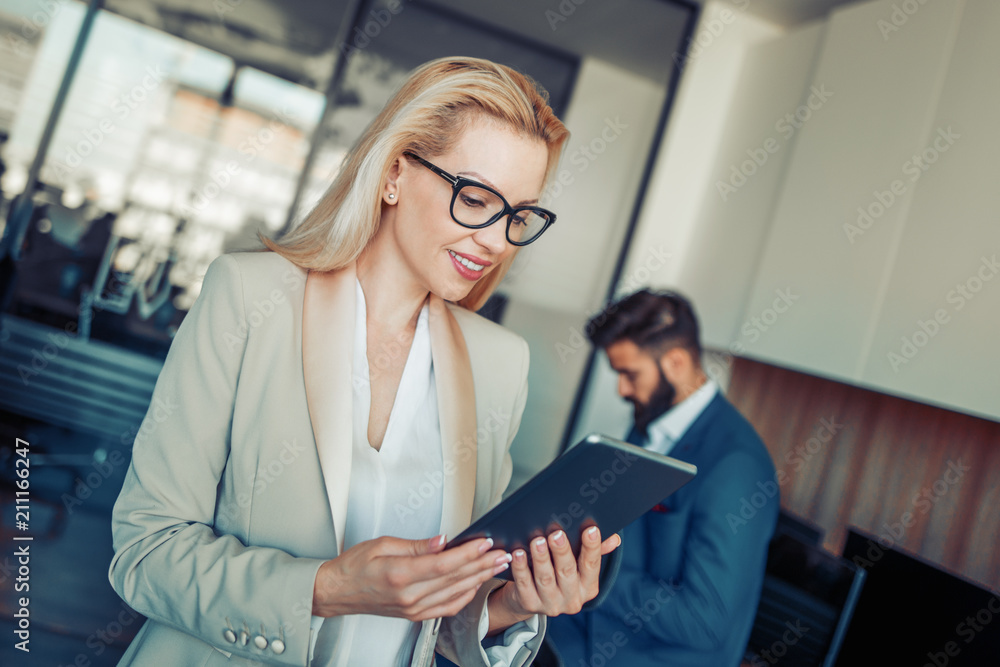 Young businesswoman using digital tablet Young businesswoman using digital tablet