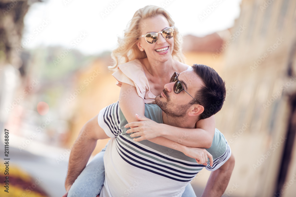 Young happy couple hugging on the city street Young happy couple hugging on the city street