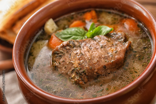 Crock pot with stewed meat, closeup