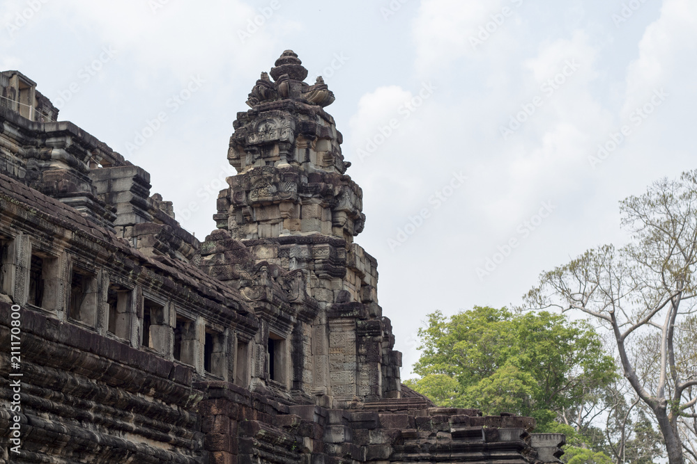 Ancient temple remains in Angkor Wat. Baphuon temple tower landscape. Buddhist or hindu temple Ancient temple remains in Angkor Wat. Baphuon temple tower landscape. Buddhist or hindu temple