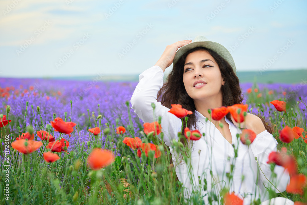 young girl is in the lavender field with red poppy flowers, beautiful summer landscape young girl is in the lavender field with red poppy flowers, beautiful summer landscape