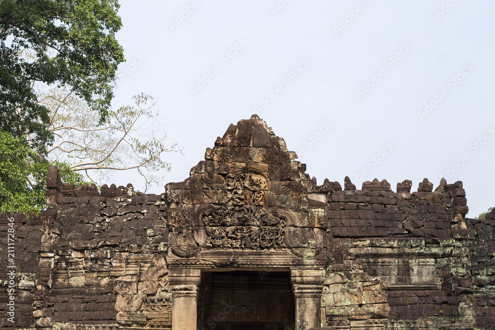 Ancient temple in Angkor Wat. Preah Khan temple entrance bas-relief stone carving. Buddhist or hindu temple.