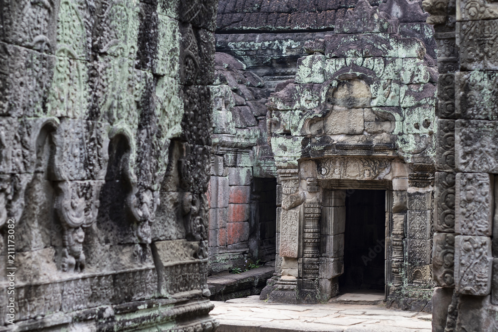 Ancient temple in Angkor Wat. Preah Khan temple mossy stone bas-relief ornament. Buddhist or hindu temple.