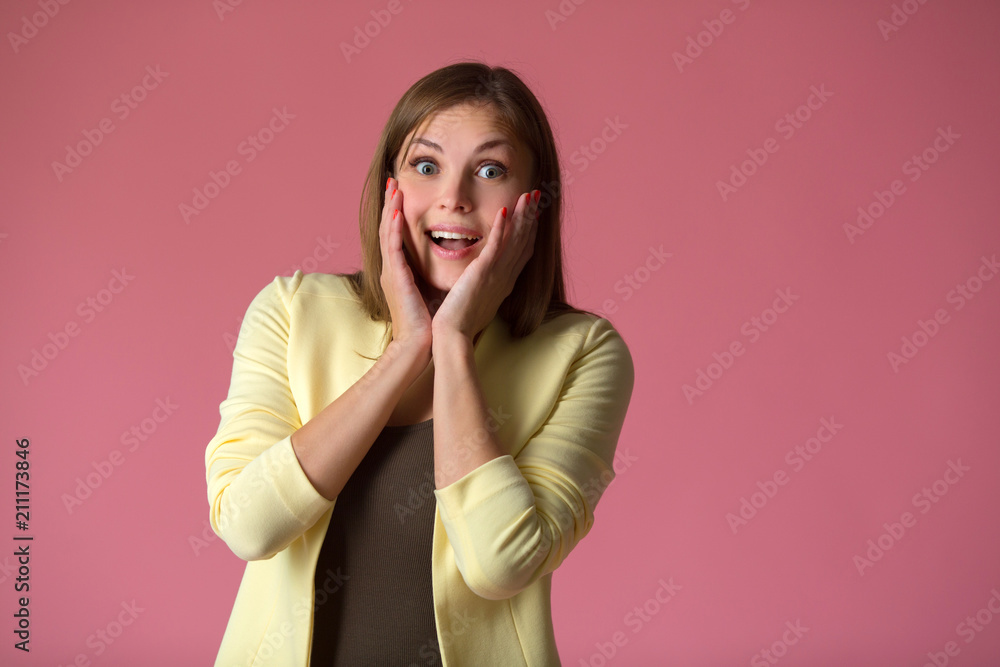 beautiful young girl in a yellow jacket on a claret background beautiful young girl in a yellow jacket on a claret background