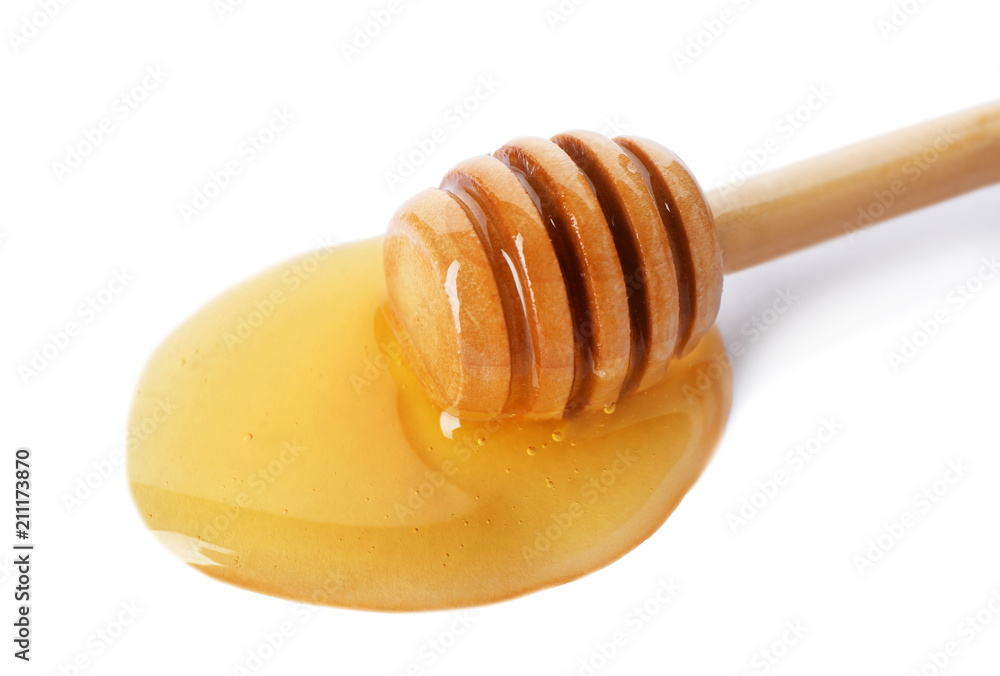 Delicious honey and dipper on white background Delicious honey and dipper on white background