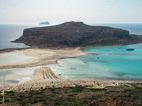 Color seascape of the beautiful Balos Lagoon separated from the homonym bay by a strip of sand that joins the promontory of Corico to Capo Tigani on the island of Crete in Greece. June, 2018 photo