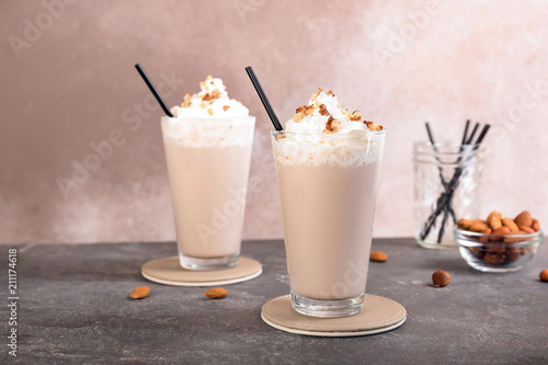 Glasses with delicious milk shakes on table
