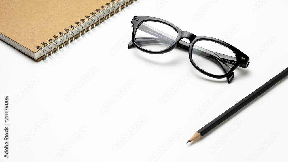 glasses, pencil and a notebook on white background- for business concept background glasses, pencil and a notebook on white background- for business concept background