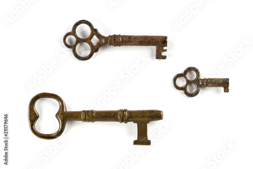 Old keys isolated on white background