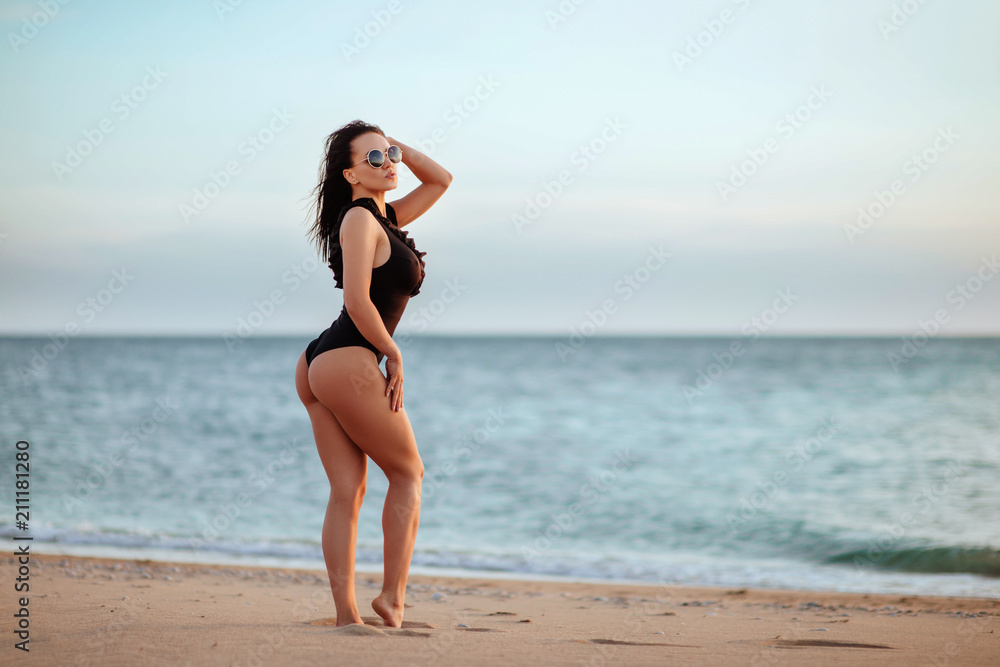 The beautiful bikini model on sunset