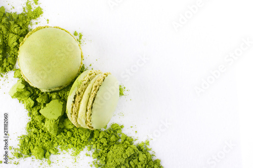 Macaroons with green tea powder matcha on white background photo