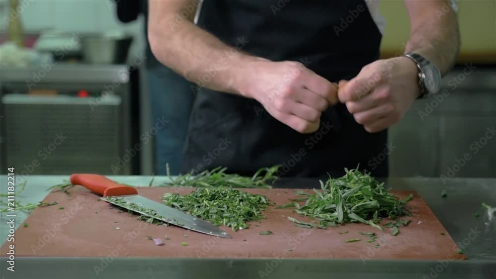Cutting Parsley. Making Salmon in Puff Pastry Series. Cutting Parsley. Making Salmon in Puff Pastry Series.