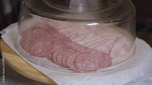 slicing sausages on a served buffet at the new hotel