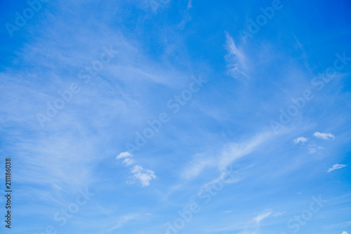 Blue sky with fluffy white clouds.