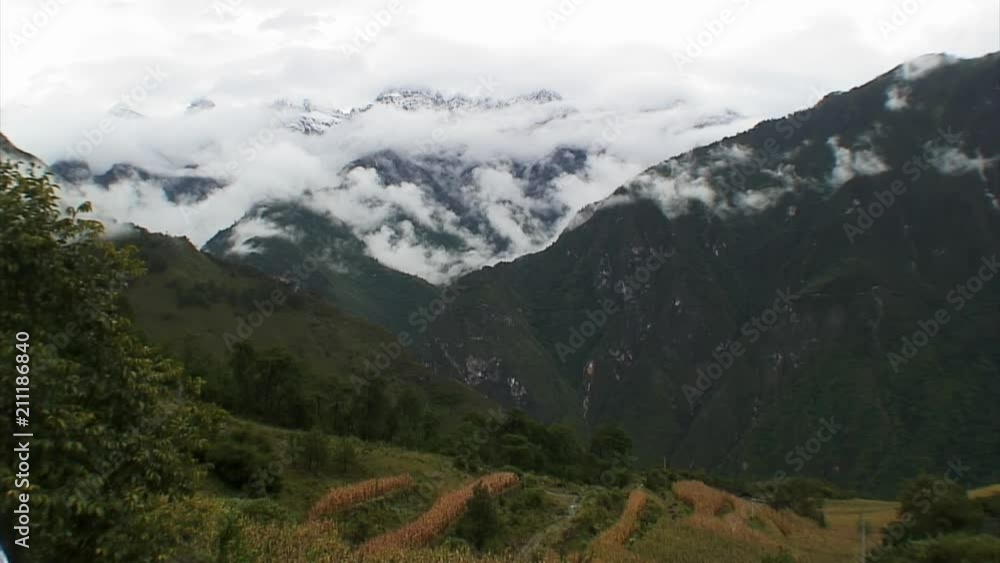 Green Lijiang Cliffs and Cropped Hills, China Green Lijiang Cliffs and Cropped Hills, China