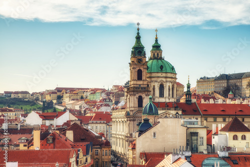 View of St Nicholas Church at Mala Strana (Kostel sv. Mikulase) Cathedral in old town and the main street to the Prague Castle from the top of the Lesser Tower photo