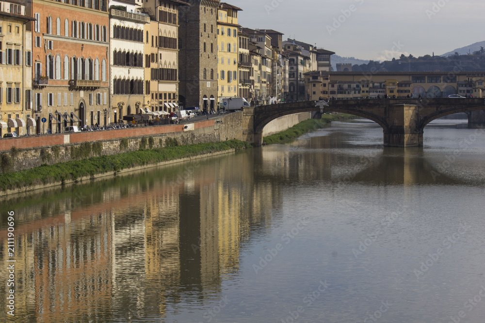Renaissance building on Florence riverbank, with an historic bridge