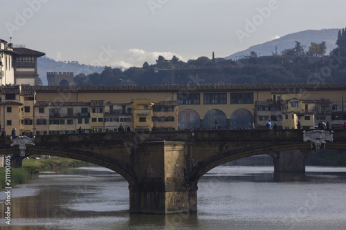 Day view of Florentine Ponte Vecchio bridge in Florence photo