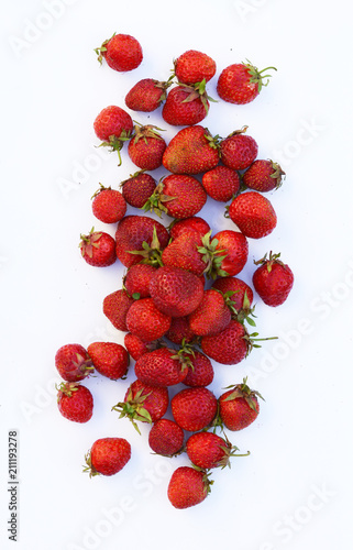 A handful of strawberries on a white background isolated, ripe berries, harvest