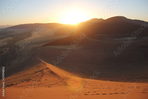 Sand dunes at sunrise in Namibia desert