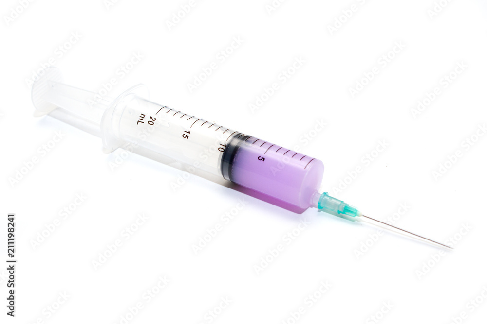 Medical syringe 20ml with liquid, lying on a white background. Equipment for vaccination in medicine for laboratories and hospitals Medical syringe 20ml with liquid, lying on a white background. Equipment for vaccination in medicine for laboratories and hospitals