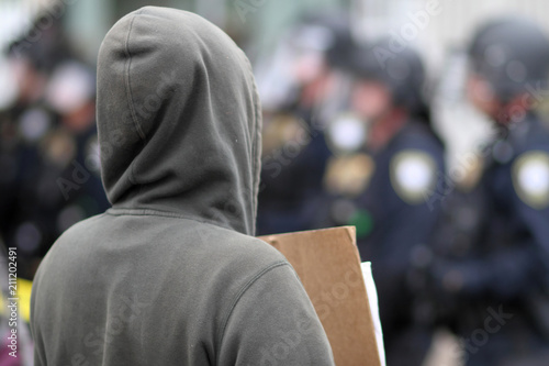 Protestor holding a sign at a rally.