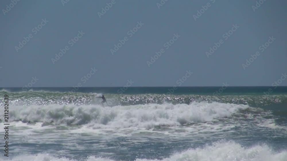 Still: Surfers Playing on the Dangerous Waves Still: Surfers Playing on the Dangerous Waves