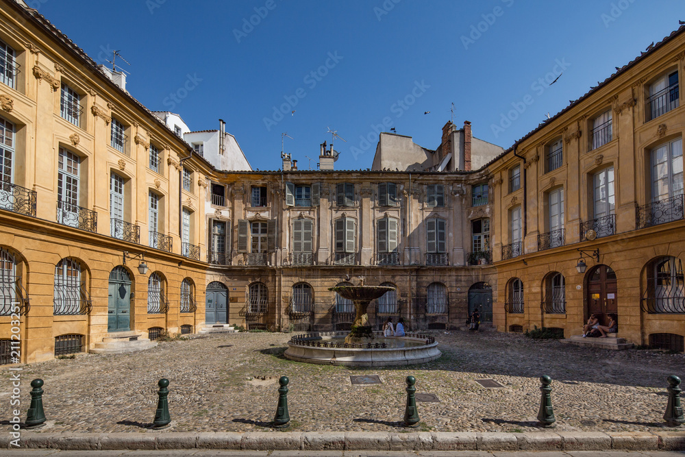 Place D'Albertas fountain and weathered old buildings in Aix-en-Provence, France