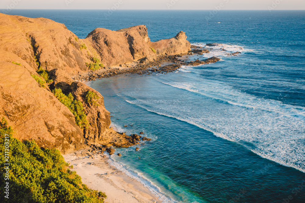 Obraz premium Tropical beach with sea and rocky cape in island