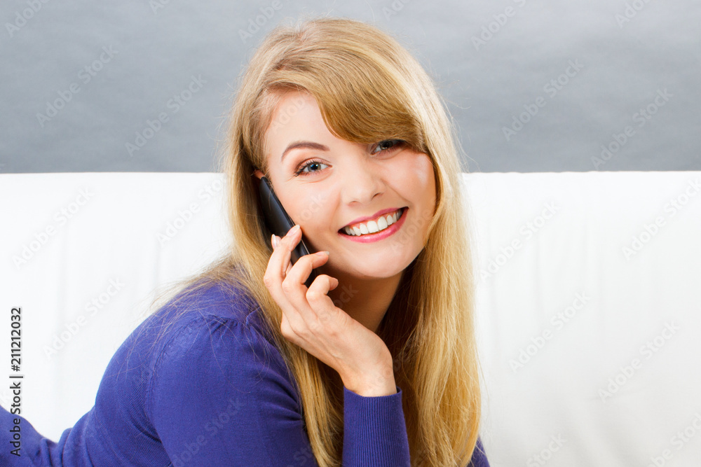 Fototapeta premium Happy smiling woman talking on mobile phone
