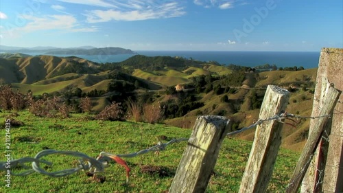 View of Distant Ocean past Green Hills  photo