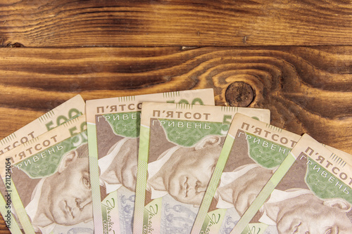Ukrainian currency. Five hundred hryvnia banknotes on wooden desk