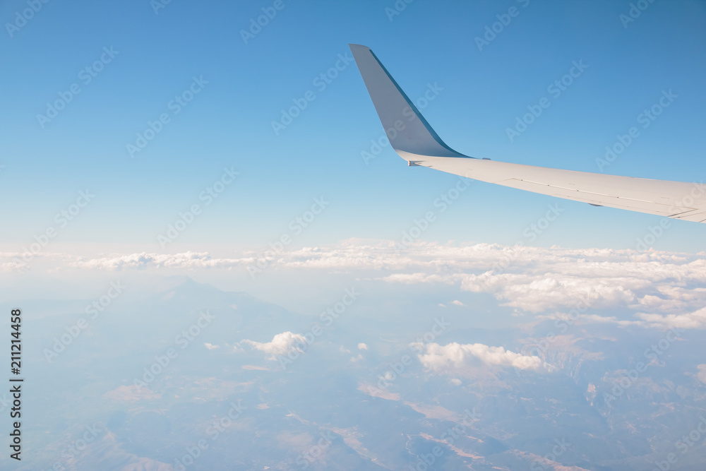Morning sunrise with Wing of an airplane. Photo applied to tourism operators. picture for add text message or frame website. Traveling concept Morning sunrise with Wing of an airplane. Photo applied to tourism operators. picture for add text message or frame website. Traveling concept