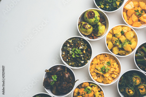 Indian sabzi / vegetable fried recipes served in white bowl over moody or colourful background. selective focus photo