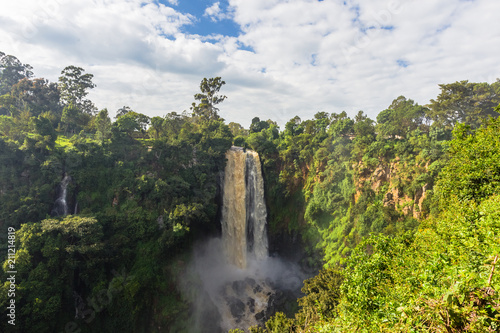 Landscape with a waterfall surrounded by wild forest. Thompson Waterfall. Kenya, Africa