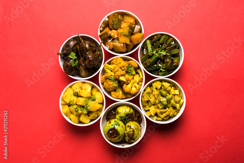 Indian sabzi / vegetable fried recipes served in white bowl over moody or colourful background. selective focus photo