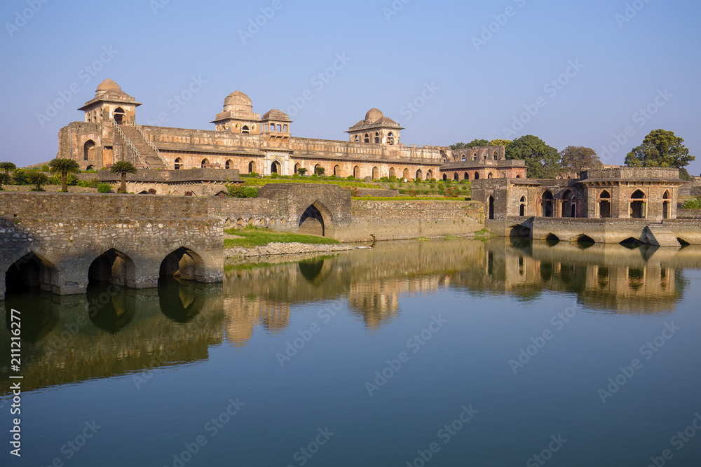 Jahaz Mahal , Ship Palace and blue water lake in sunrise. Mandu, Madhya Pradesh, India
