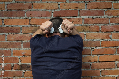 фотографія Criminal in handcuffs arrested for crimes