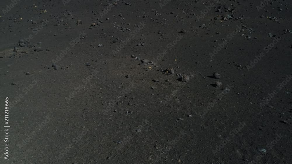 Aerial drone scene of detail of volcano with black dark lapillis rocks and lava pumps. Malargüe, La Payunia National Park, Cuyo, Mendoza. Aerial drone scene of detail of volcano with black dark lapillis rocks and lava pumps. Malargüe, La Payunia National Park, Cuyo, Mendoza.
