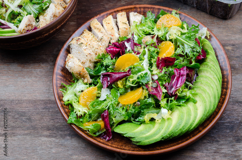 green salad with avocado, chicken and citrus