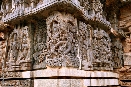 Ornate bas relieif and sculptures of Hindu deities, Kedareshwara Temple, Halebid, Karnataka photo