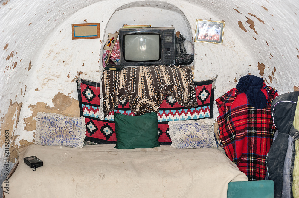 Household items in the cave-bedroom of the cave house of troglodytes. Tunisia, Matmata. Household items in the cave-bedroom of the cave house of troglodytes. Tunisia, Matmata.
