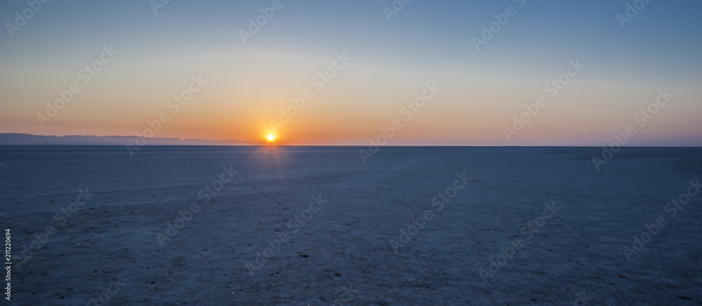 Fototapeta premium Sunrise over the salt lake of El Jerid.