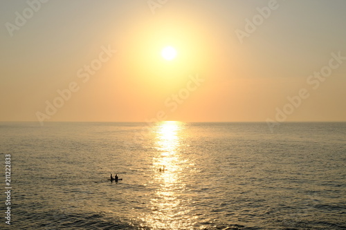 sun with kayak photo