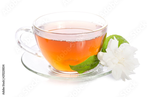 Glass cup of Tea with jasmine flowers and leaves isolated on white background