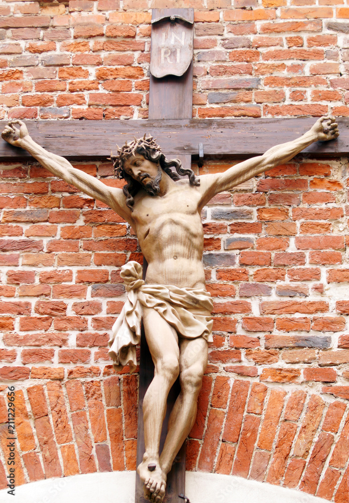 Crucifix on brick wall