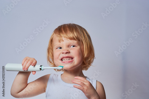 baby brushing her teeth