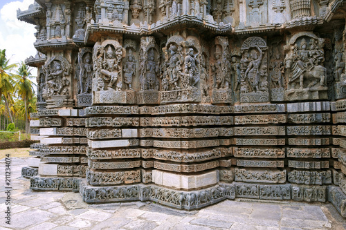 Ornate bas relieif and sculptures of Hindu deities, Kedareshwara Temple, Halebid, Karnataka photo